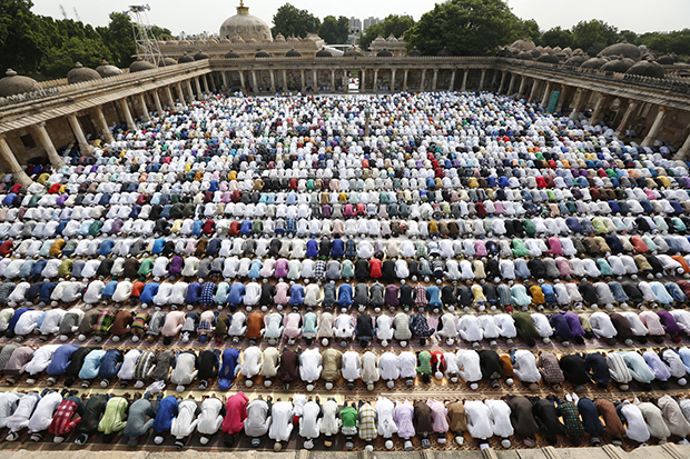 Indian Muslims offer Eid al-Adha prayers at Sarkhej Roja in Ahmadabad, India, Tuesday, Sept. 13, 2016. Muslims worldwide are celebrating Eid al-Adha, or "Feast of Sacrifice," that commemorates the willingness of the Prophet Ibrahim to sacrifice his son before God stayed his hand. During the holiday, Muslims slaughter livestock and distribute part of the meat to the poor. (AP Photo/Ajit Solanki)