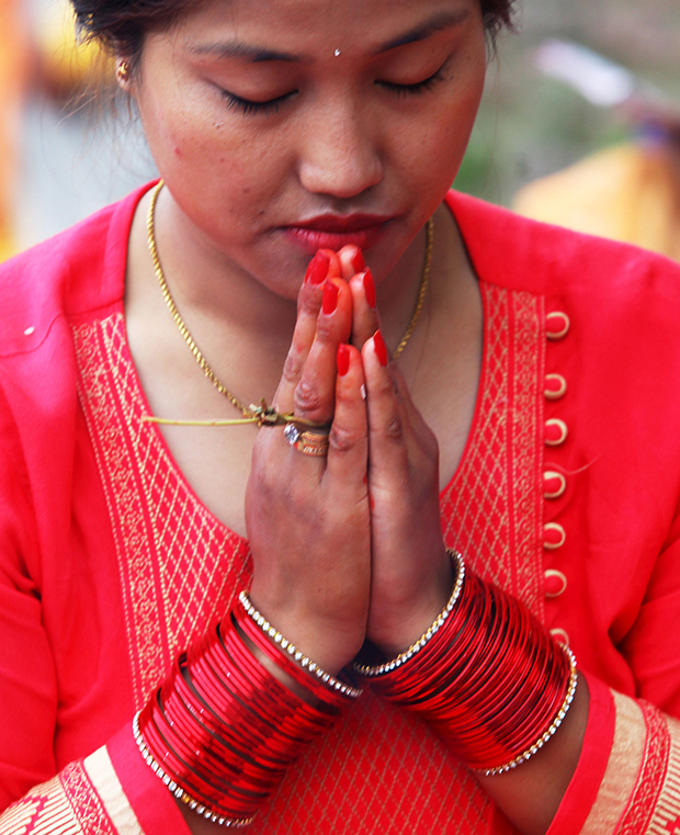 (160906) -- KATHMANDU, Sept. 6, 2016 (Xinhua) -- A Hindu woman offers prayers during the Rishi Panchami festival in Kathmandu, Nepal, Sept. 6, 2016. Rishi Panchami festival marks the end of the three-day Teej festival when women worship Sapta Rishi (Seven Saints) and pray for health for their husband while unmarried women wish for handsome husband and happy conjugal lives. (Xinhua/Sunil Sharma)(axy)